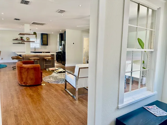 a workspace with furniture and wooden floor
