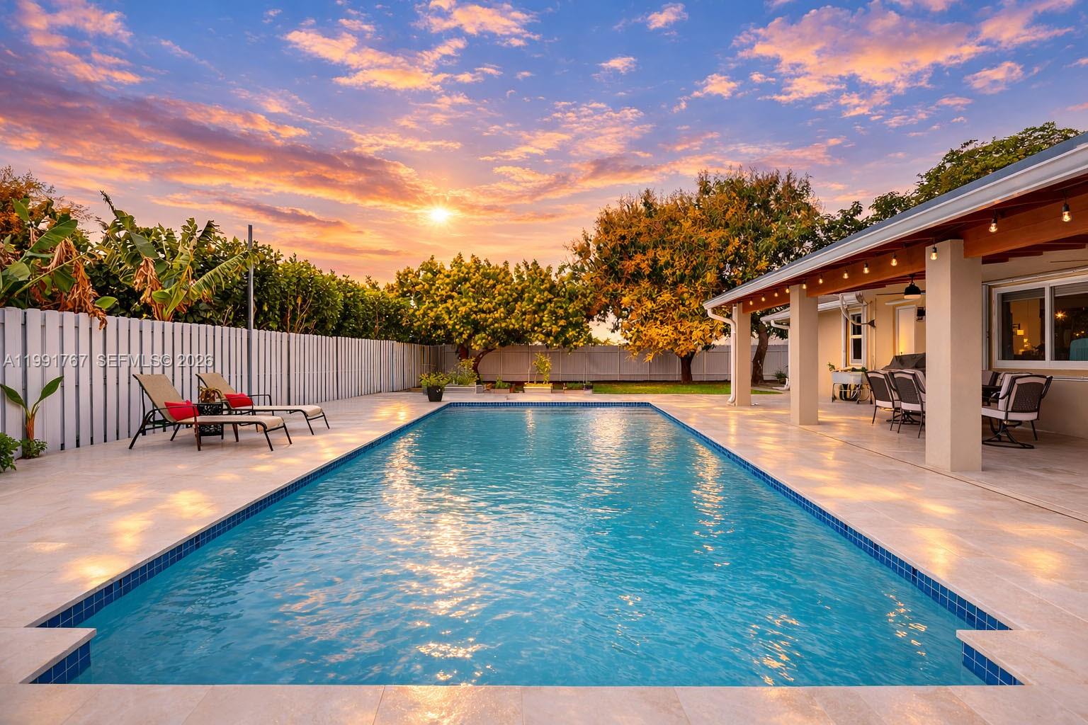 15382 Southwest 153rd Street Miami, FL 33187 - Photo 13 of 65 a view of swimming pool with seating space