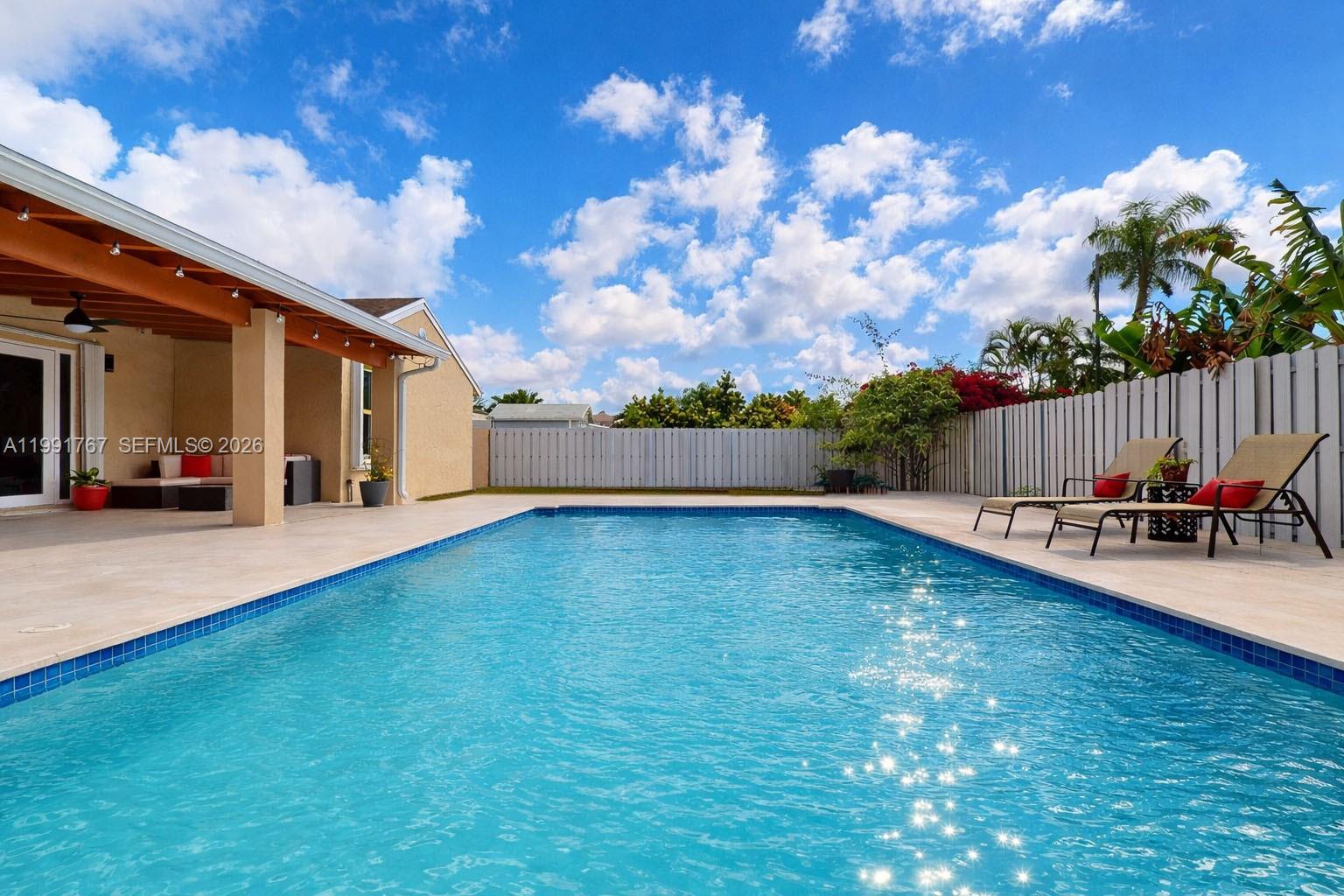 15382 Southwest 153rd Street Miami, FL 33187 - Photo 17 of 65 a view of a backyard with sitting area