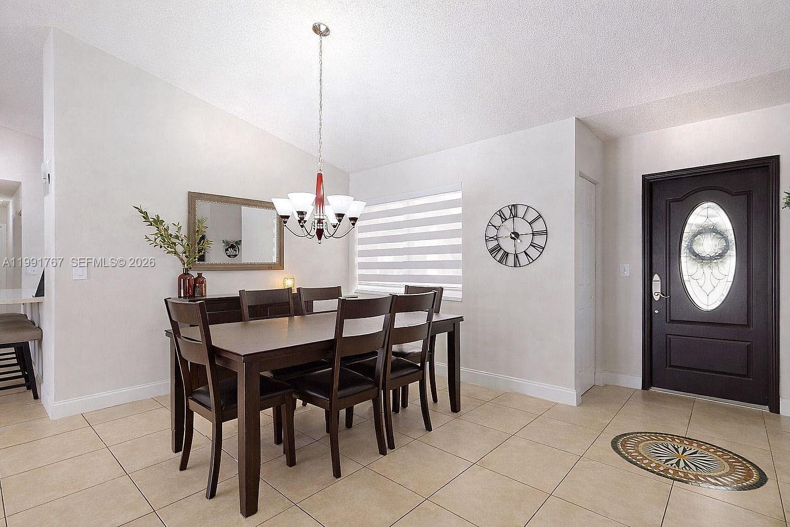15382 Southwest 153rd Street Miami, FL 33187 - Photo 27 of 65 a view of a dining room with furniture