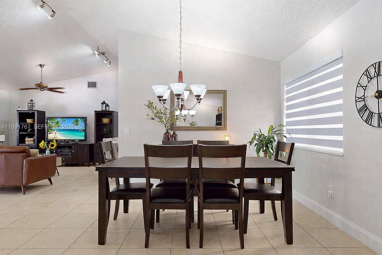 15382 Southwest 153rd Street Miami, FL 33187 - Photo 28 of 65 a dining room with furniture and window
