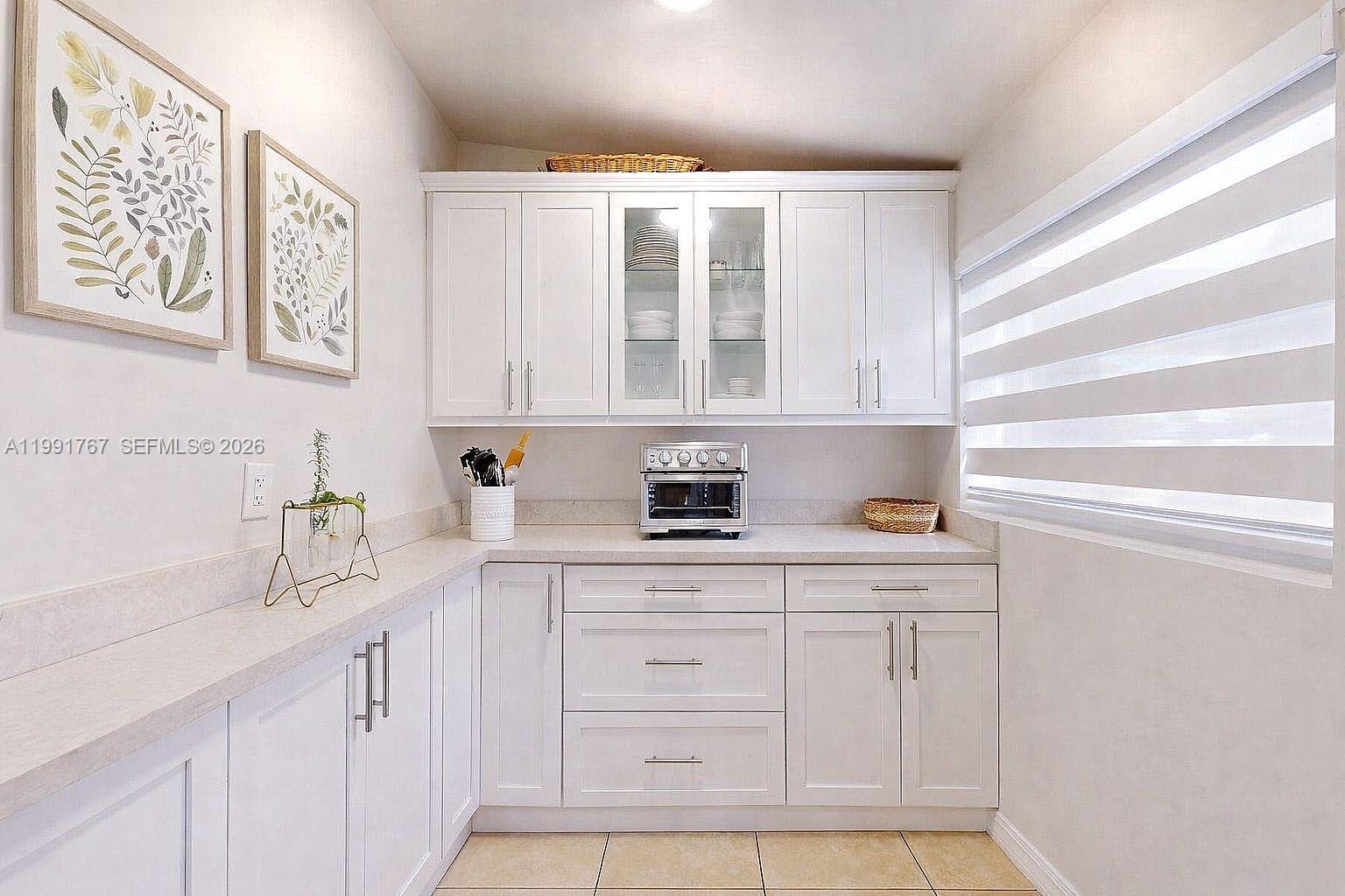 15382 Southwest 153rd Street Miami, FL 33187 - Photo 34 of 65 a kitchen with a sink cabinets and window