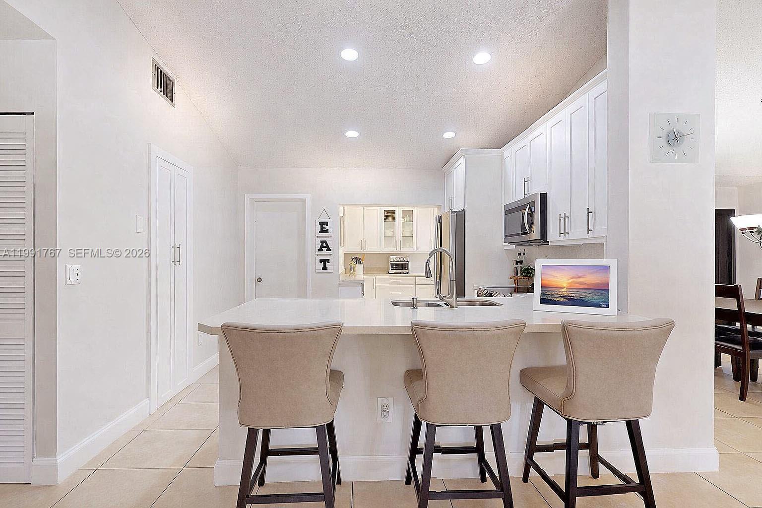 15382 Southwest 153rd Street Miami, FL 33187 - Photo 38 of 65 a dining room with furniture and window