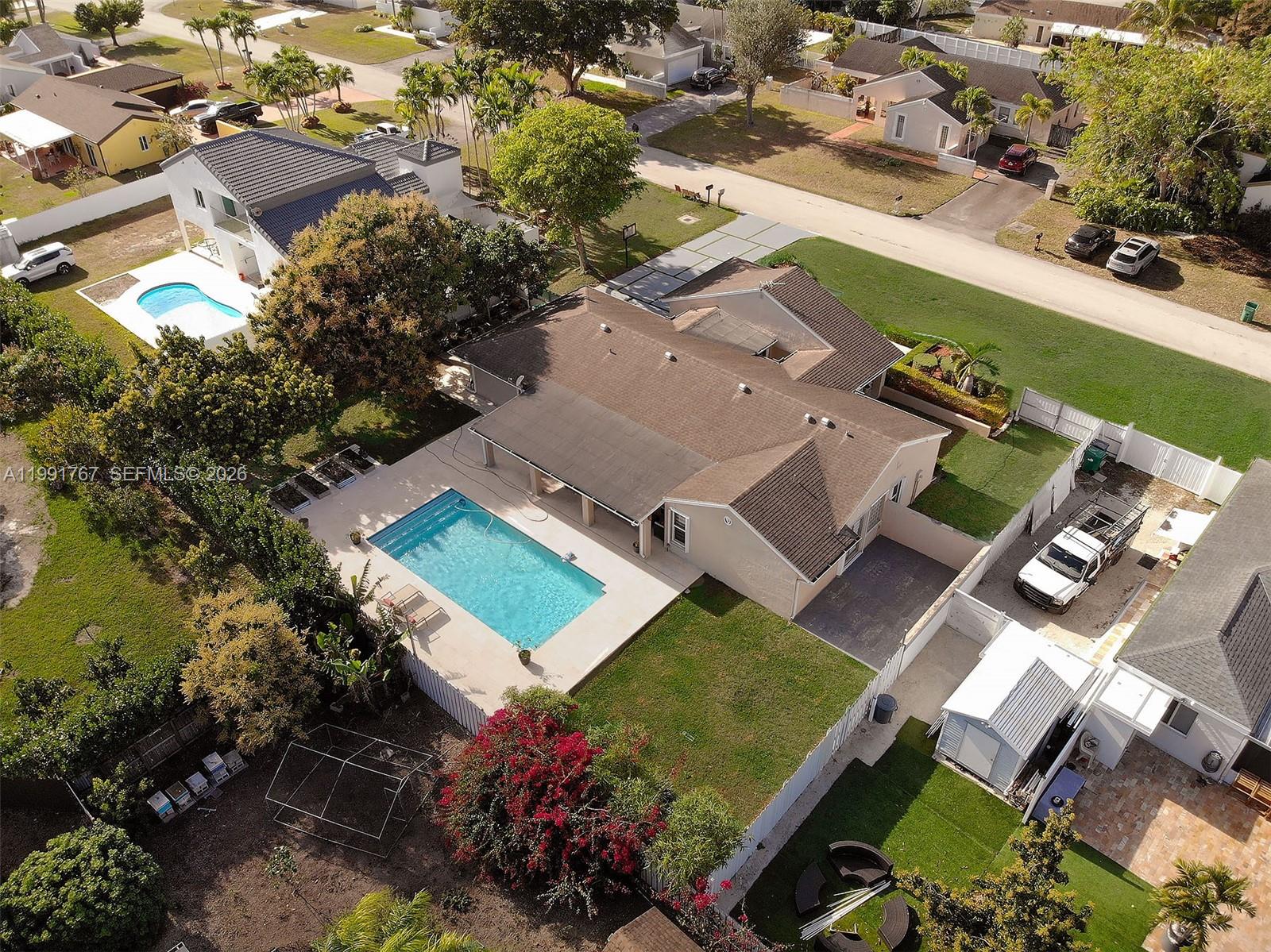 15382 Southwest 153rd Street Miami, FL 33187 - Photo 4 of 65 an aerial view of a house with a garden
