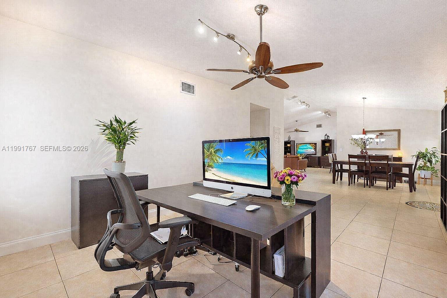15382 Southwest 153rd Street Miami, FL 33187 - Photo 41 of 65 a view of a workspace with furniture