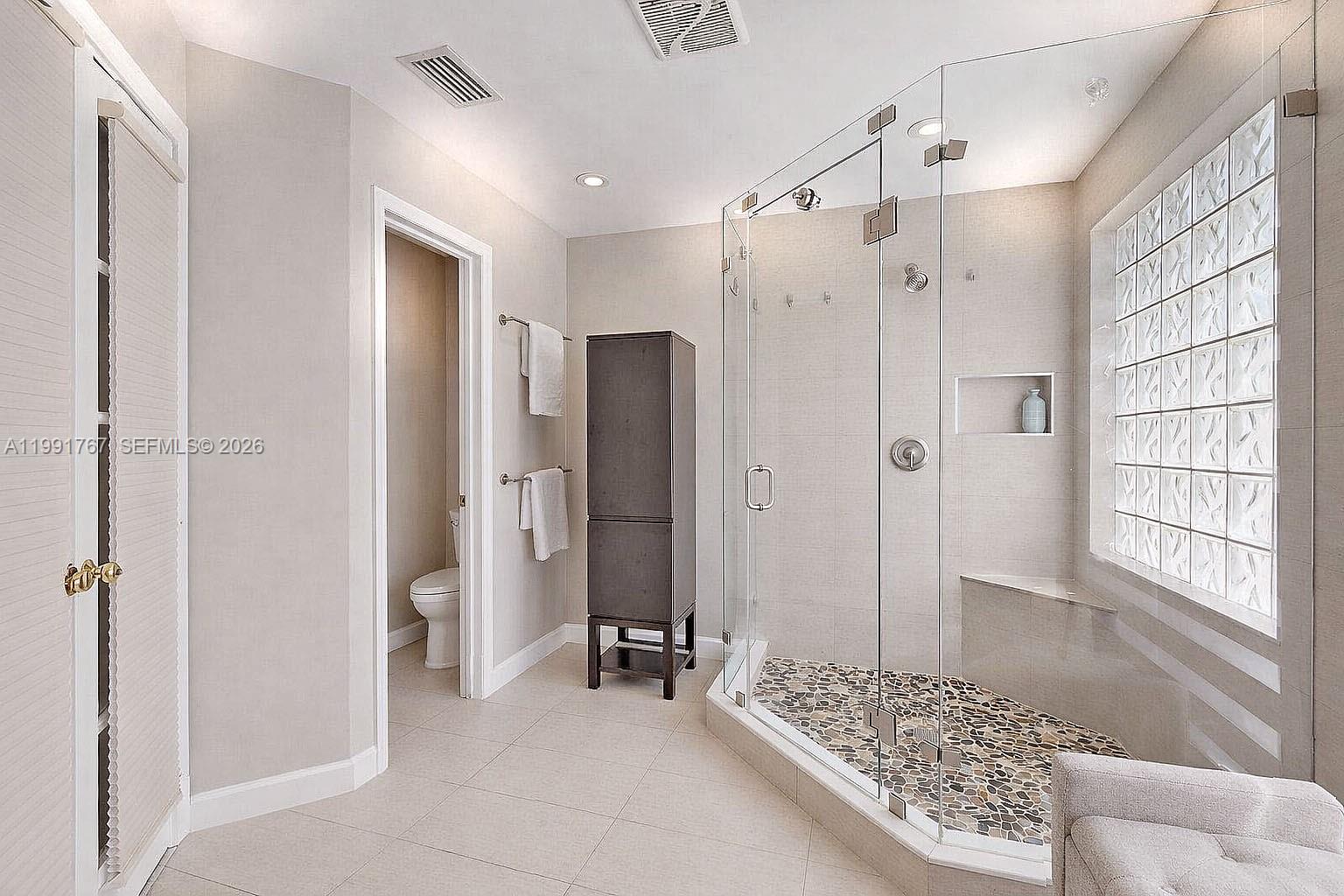 15382 Southwest 153rd Street Miami, FL 33187 - Photo 47 of 65 a bathroom with a shower and a sink