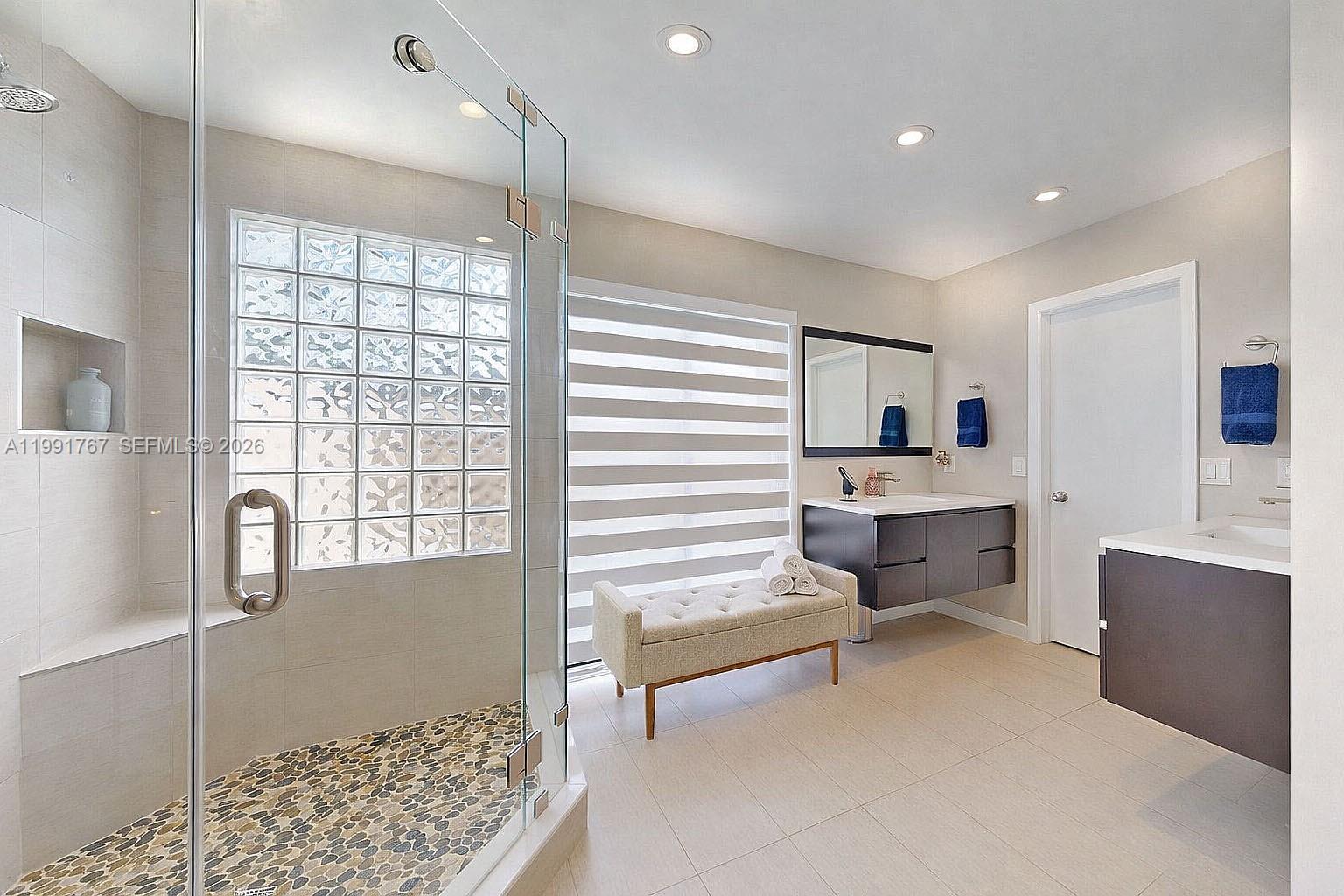15382 Southwest 153rd Street Miami, FL 33187 - Photo 49 of 65 a large room with chandelier fan and windows