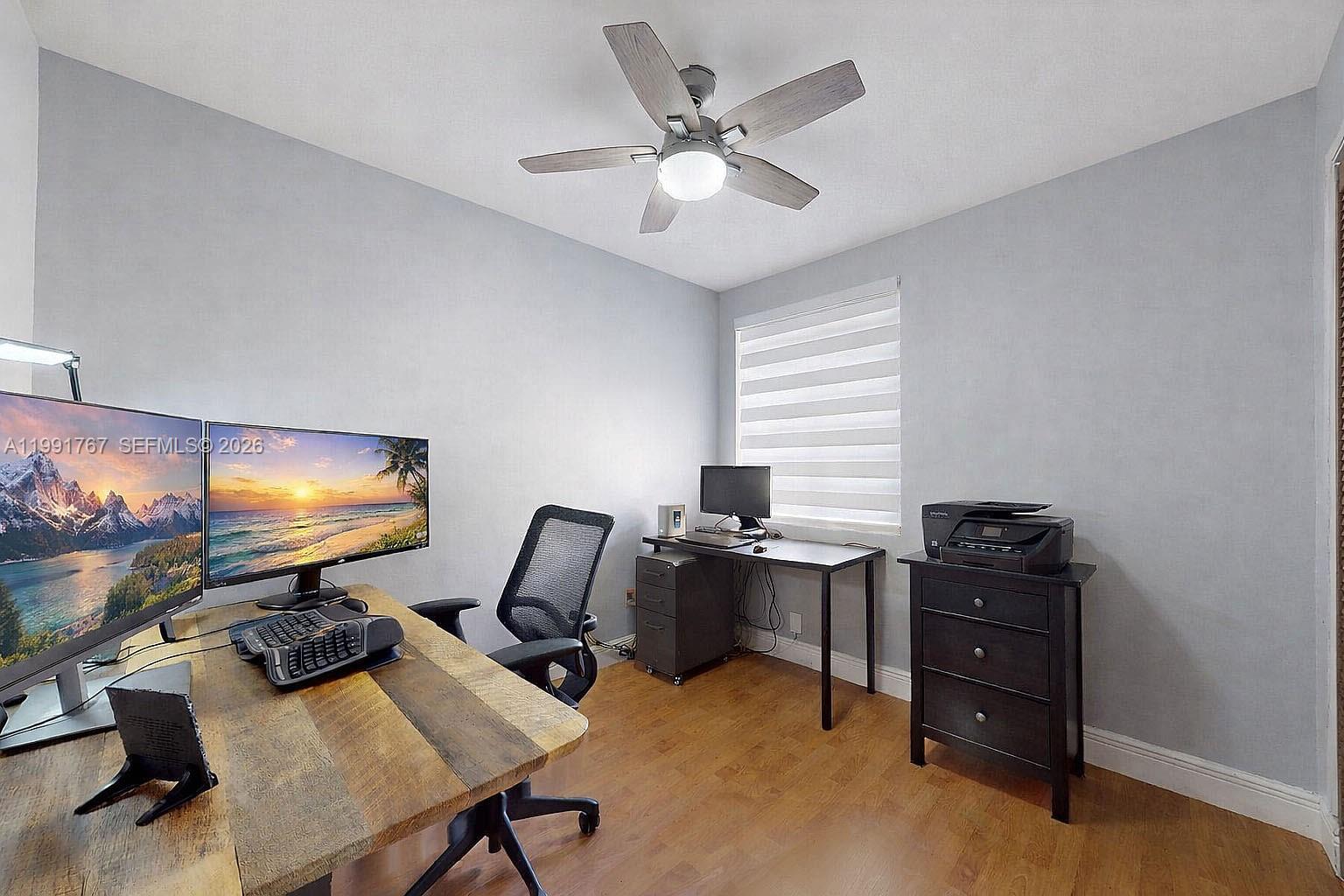 15382 Southwest 153rd Street Miami, FL 33187 - Photo 55 of 65 a view of a workspace with furniture and a window