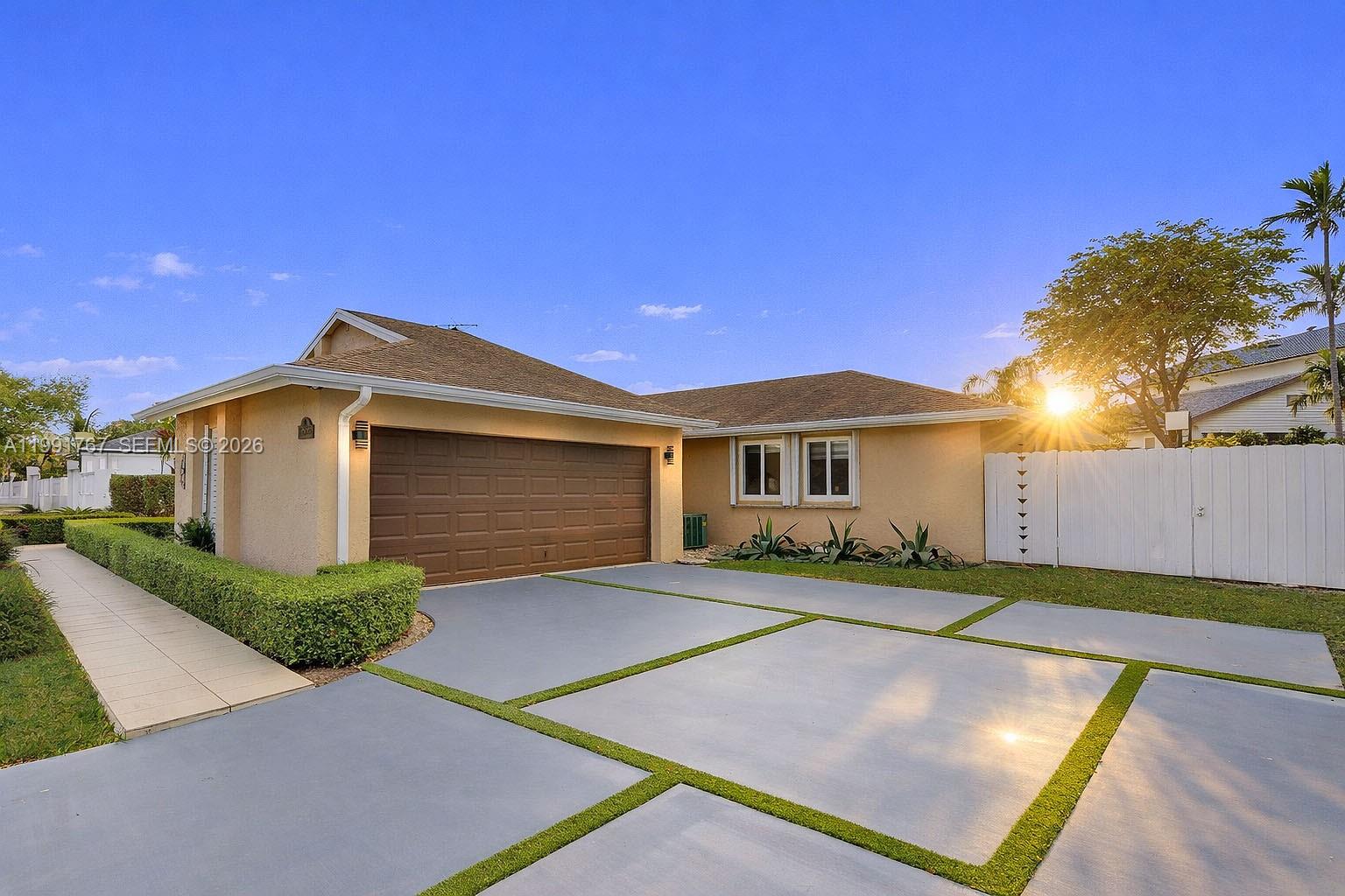15382 Southwest 153rd Street Miami, FL 33187 - Photo 56 of 65 a front view of a house with a yard