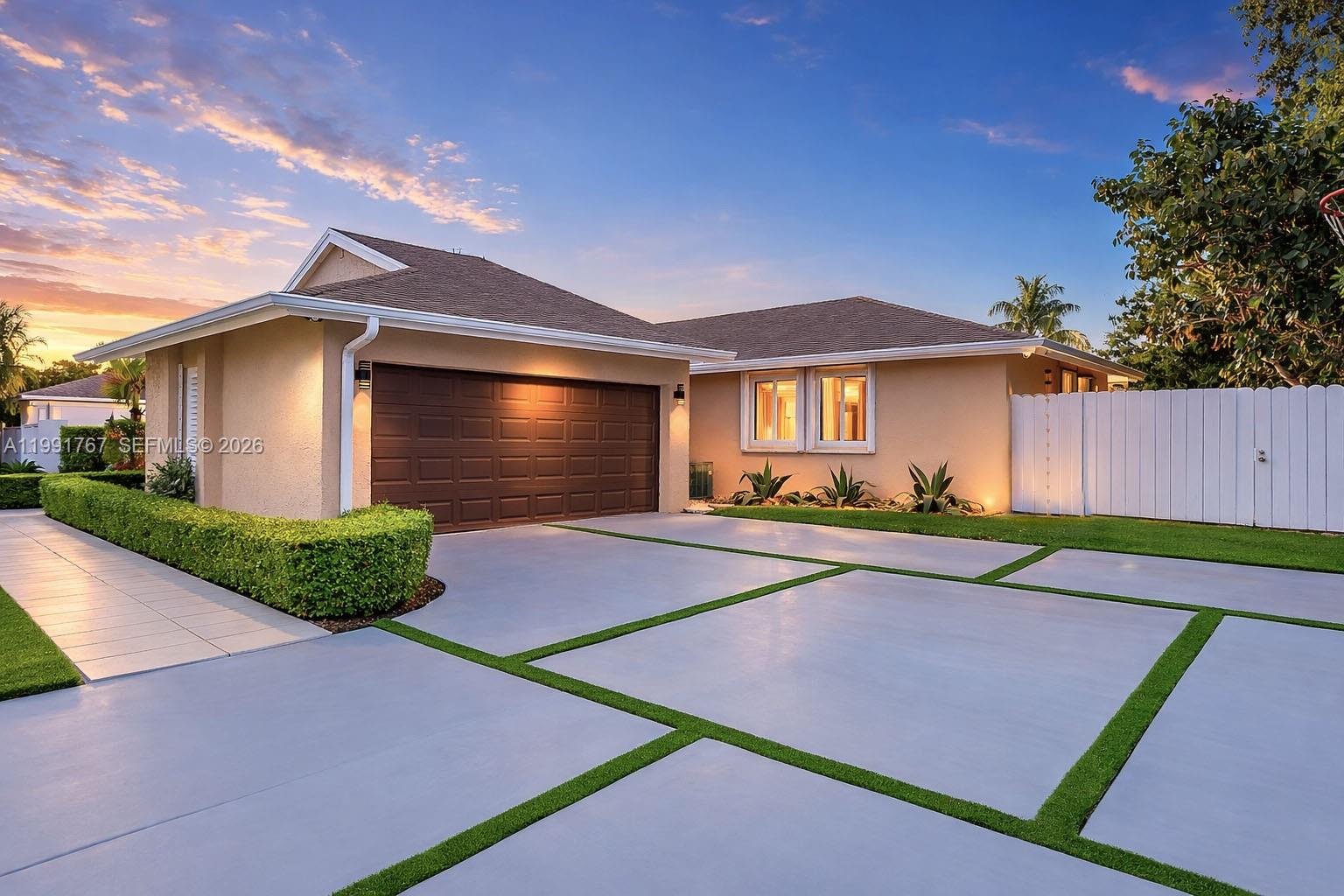 15382 Southwest 153rd Street Miami, FL 33187 - Photo 60 of 65 a front view of a house with garden