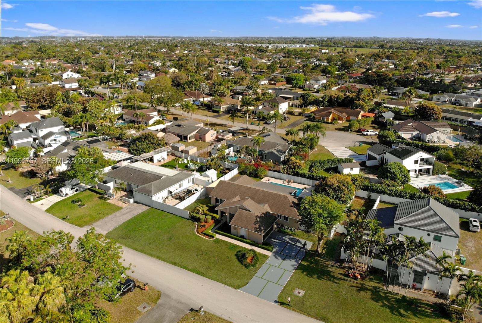 15382 Southwest 153rd Street Miami, FL 33187 - Photo 6 of 65 an aerial view of residential houses with outdoor space
