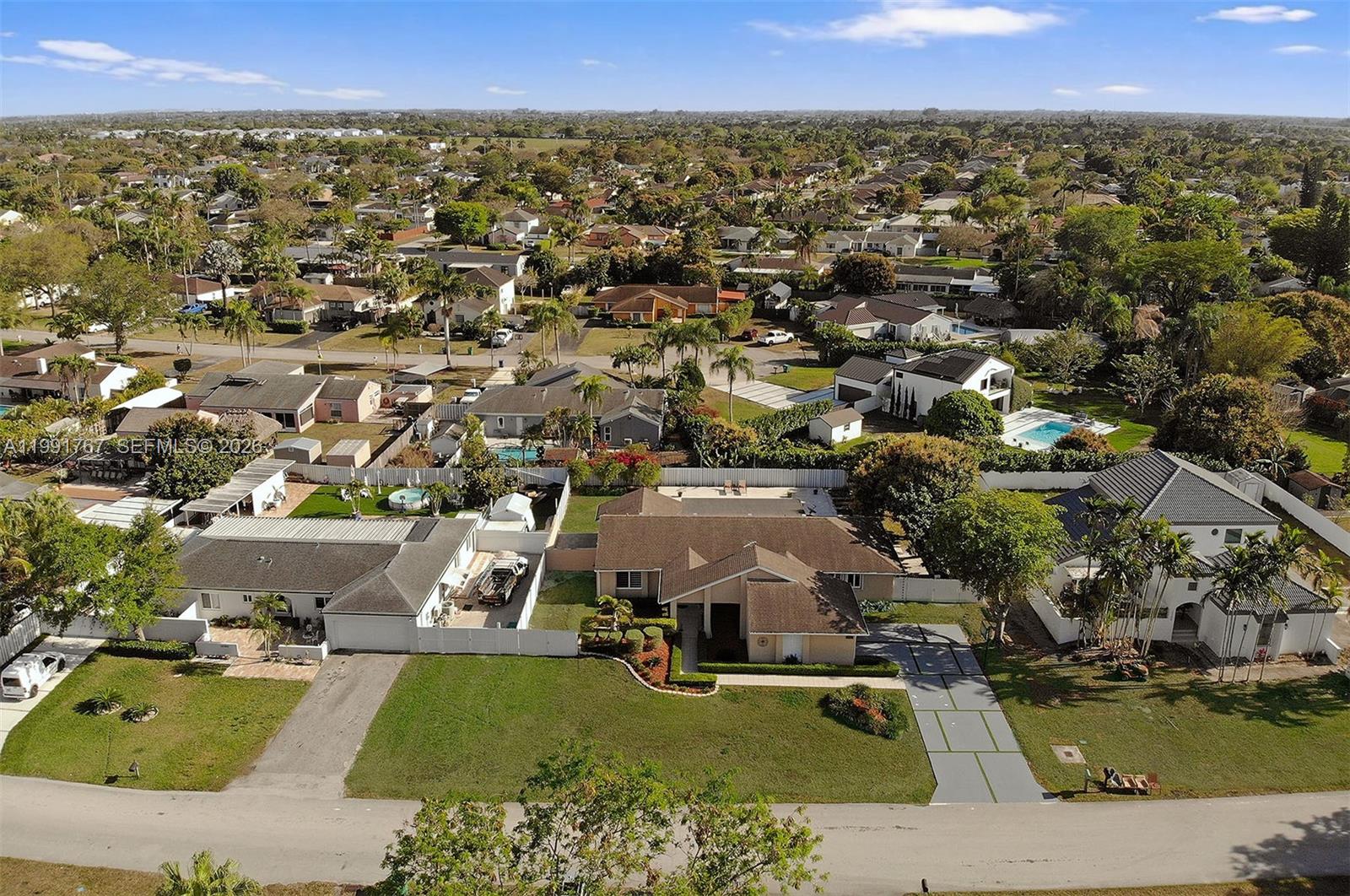 15382 Southwest 153rd Street Miami, FL 33187 - Photo 7 of 65 an aerial view of a house with a garden