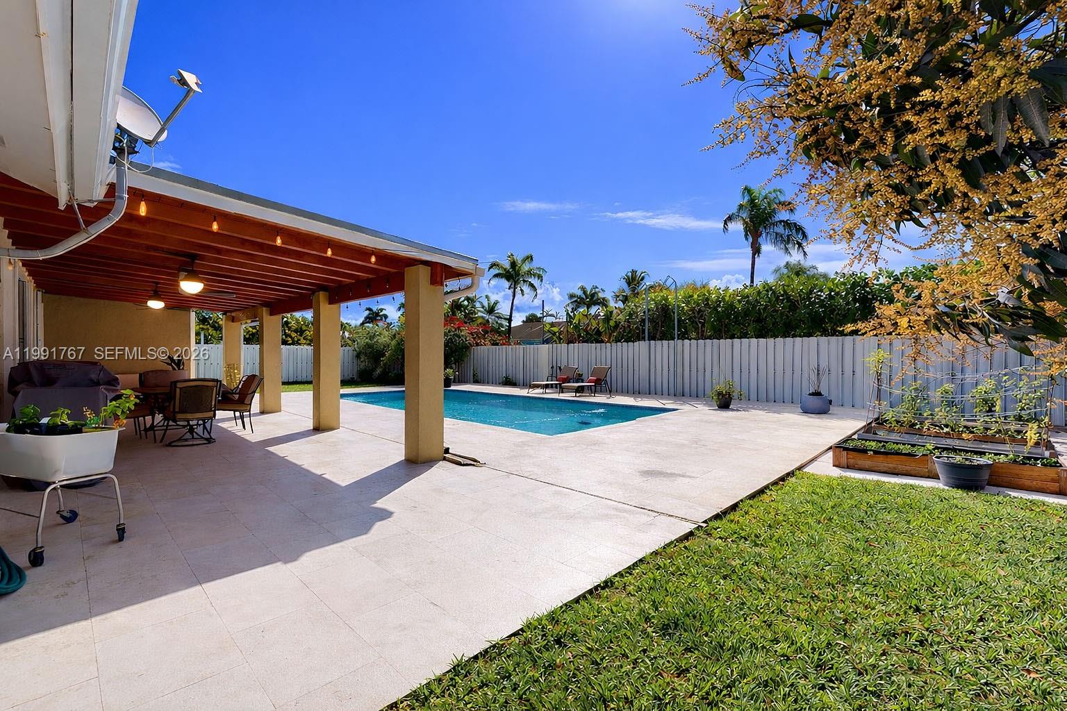 15382 Southwest 153rd Street Miami, FL 33187 - Photo 8 of 65 a view of yard with patio