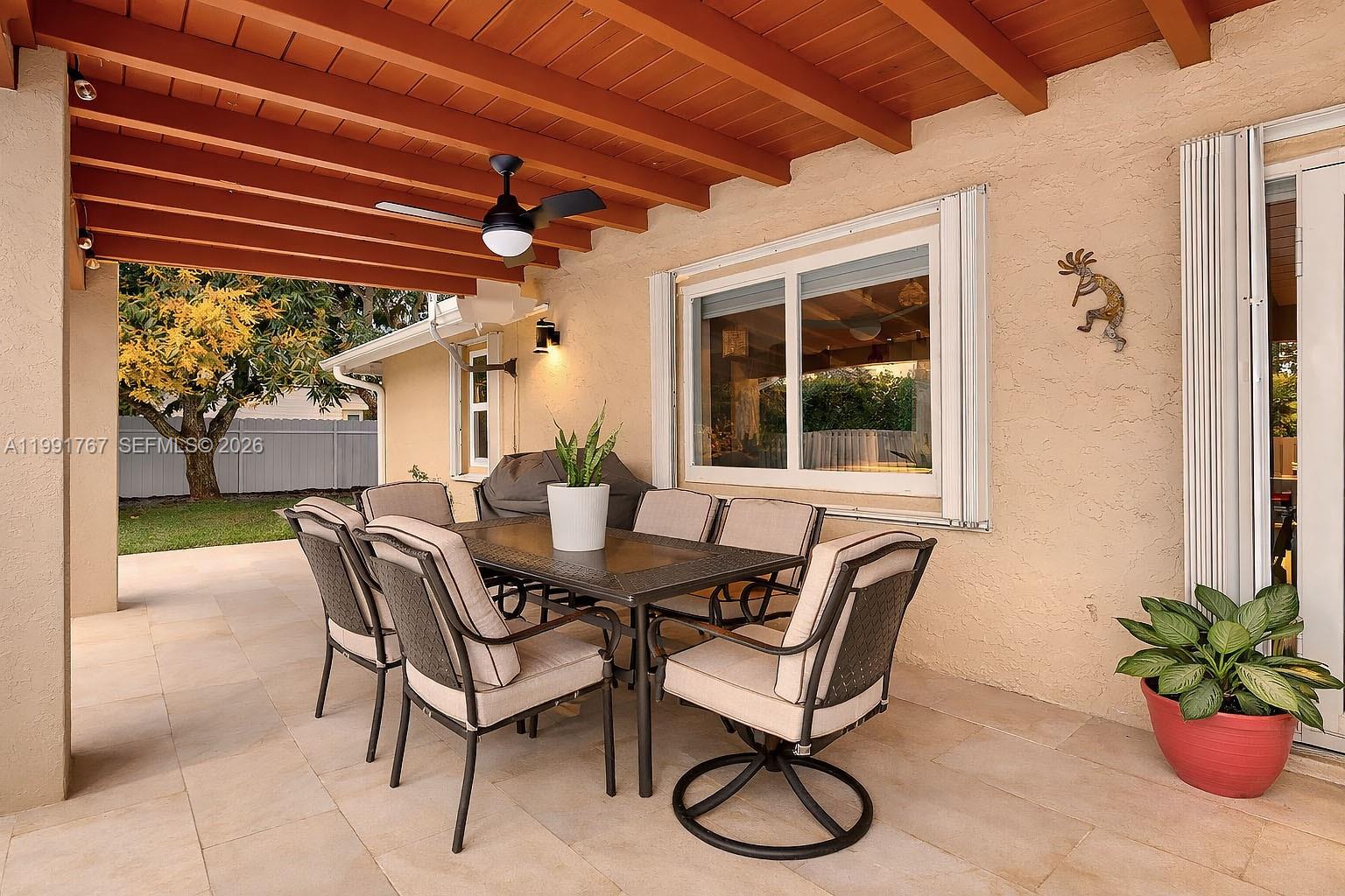 15382 Southwest 153rd Street Miami, FL 33187 - Photo 10 of 65 a dining room with furniture and a potted plant