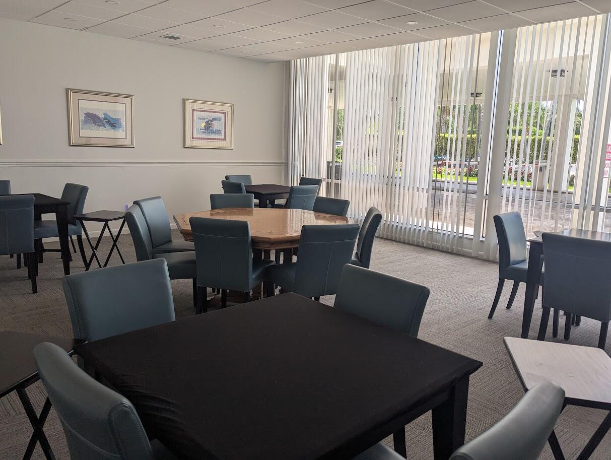 2121 North Ocean Boulevard, Unit 1006E Boca Raton, FL 33431 - Photo 62 of 64 a view of a dining room with furniture and wooden floor