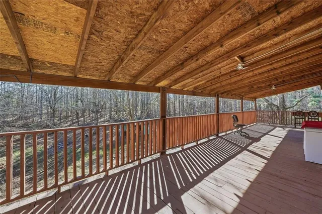 a view of balcony with wooden floor