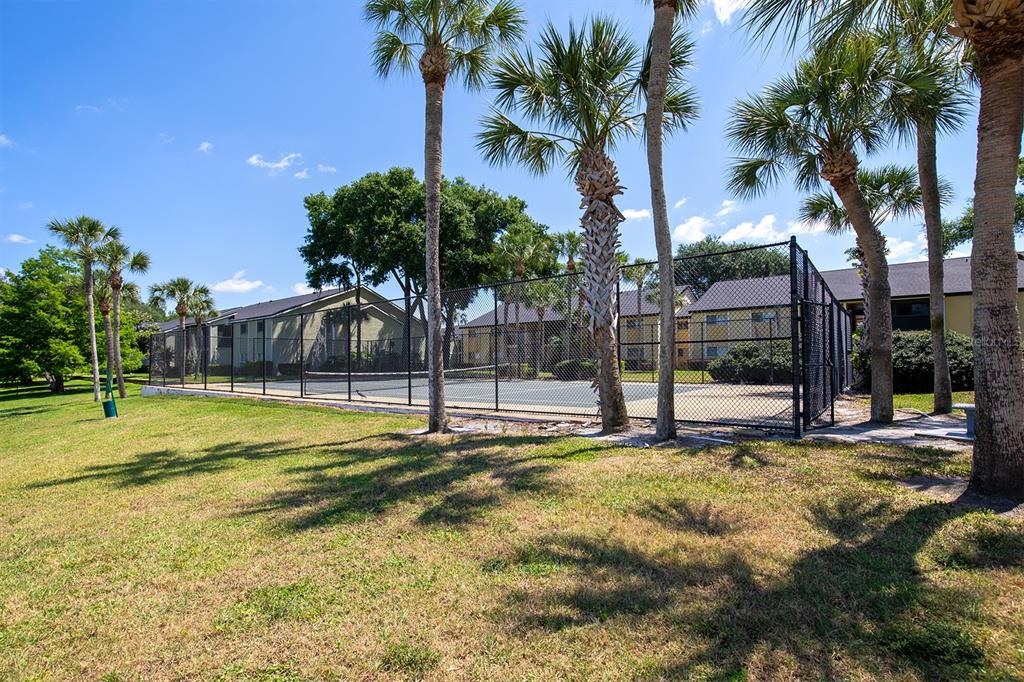 954 Lake Destiny Road, Unit H Altamonte Springs, FL 32714 - Photo 12 of 17 a view of swimming pool with palm trees