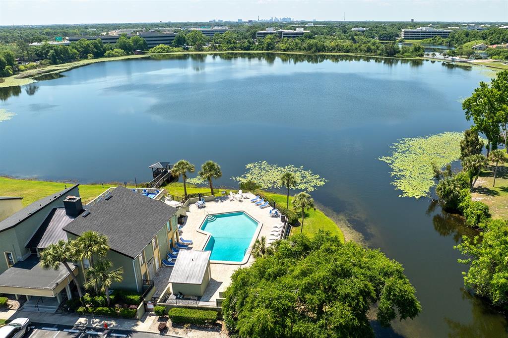 954 Lake Destiny Road, Unit H Altamonte Springs, FL 32714 - Photo 14 of 17 an aerial view of lake residential house with swimming pool and outdoor space