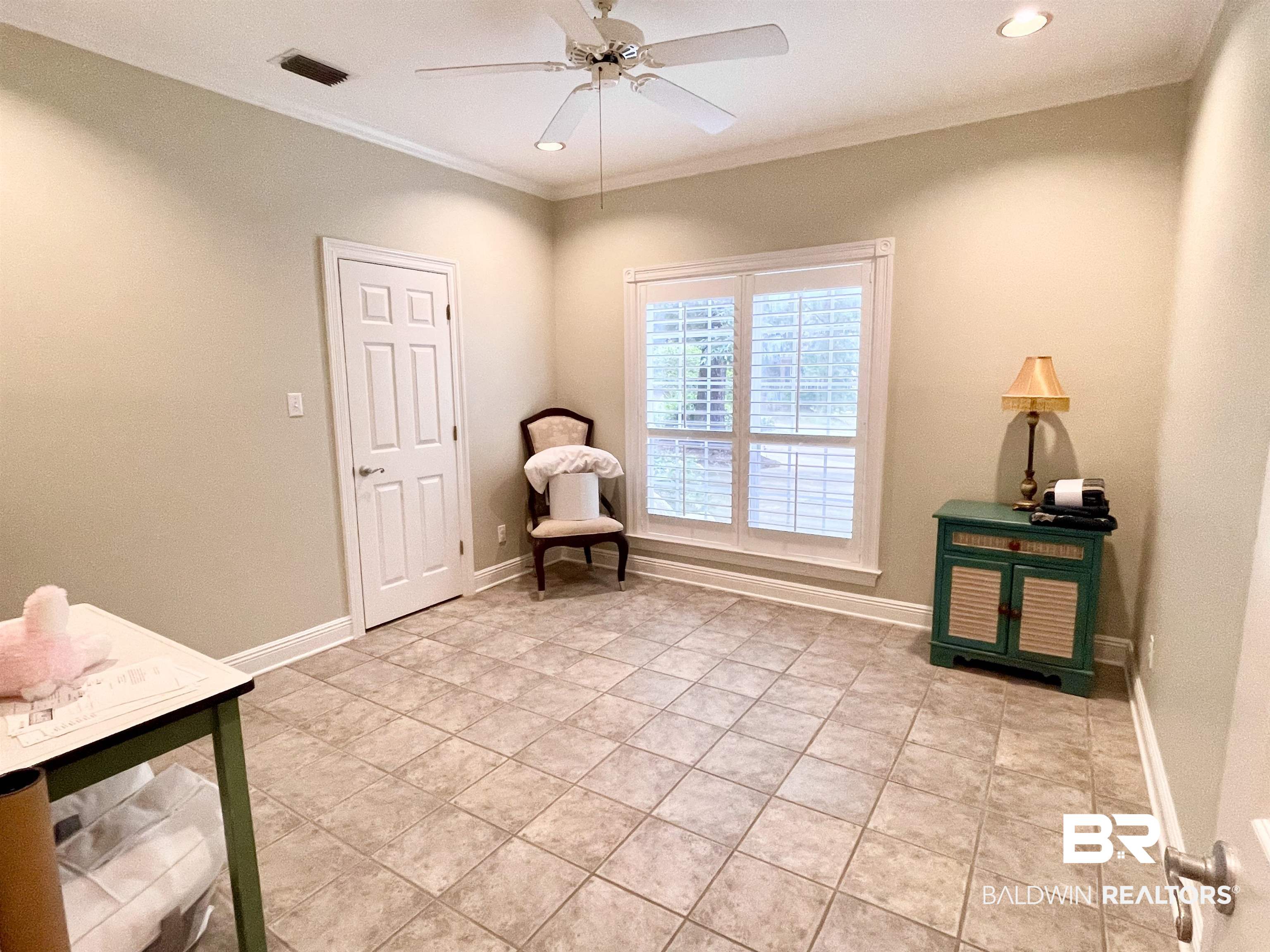 202 Potters Mills Road Daphne, AL 36526 - Photo 20 of 29 Living area featuring crown molding, light tile patterned floors, and ceiling fan