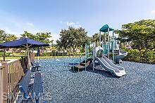 16188 Parque Lane Naples, FL 34110 - Photo 12 of 15 a view of a chairs and table in backyard