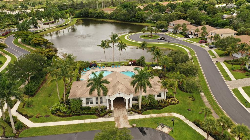16188 Parque Lane Naples, FL 34110 - Photo 13 of 15 an aerial view of residential houses with outdoor space and lake view