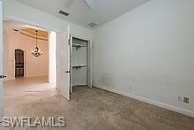 16188 Parque Lane Naples, FL 34110 - Photo 8 of 15 an empty room with a door