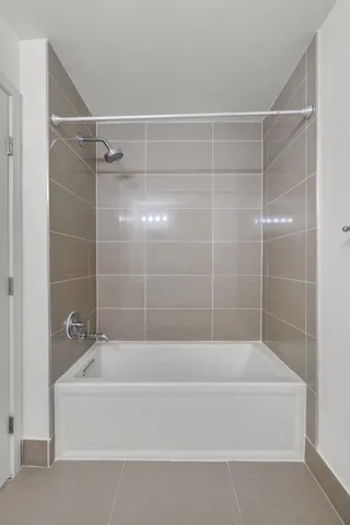 a bathroom with a shower and a bathtub