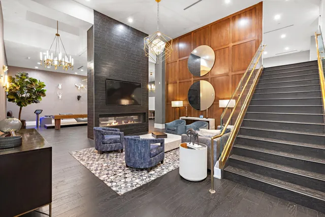 a room with lots of light fixtures and wooden floor