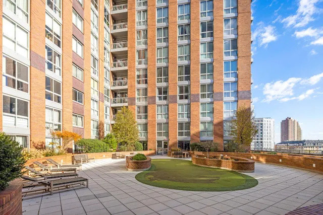 a view of a swimming pool with a lounge chairs