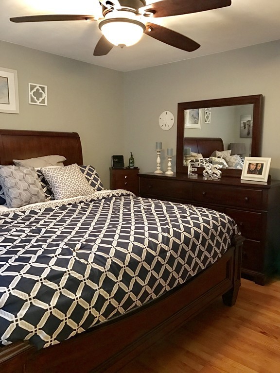 3 Diamond Street Fairhaven, MA 02719 - Photo 12 of 17 a bedroom with a bed and wooden floor