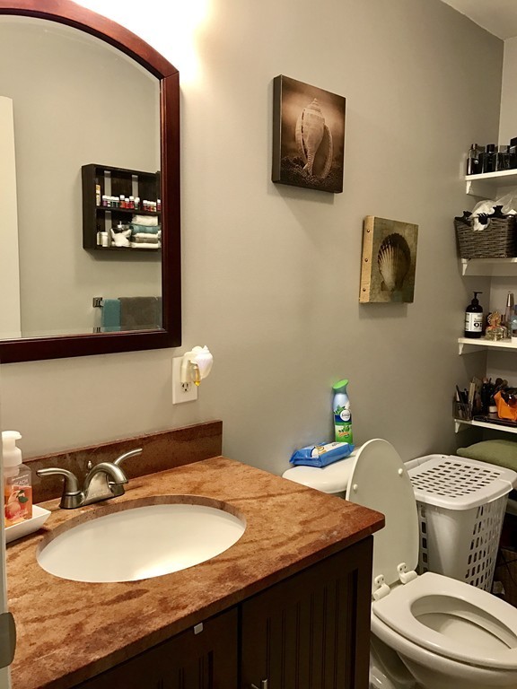 3 Diamond Street Fairhaven, MA 02719 - Photo 13 of 17 a bathroom with a granite countertop sink and a mirror
