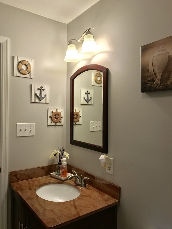 3 Diamond Street Fairhaven, MA 02719 - Photo 14 of 17 a bathroom with a sink and a mirror