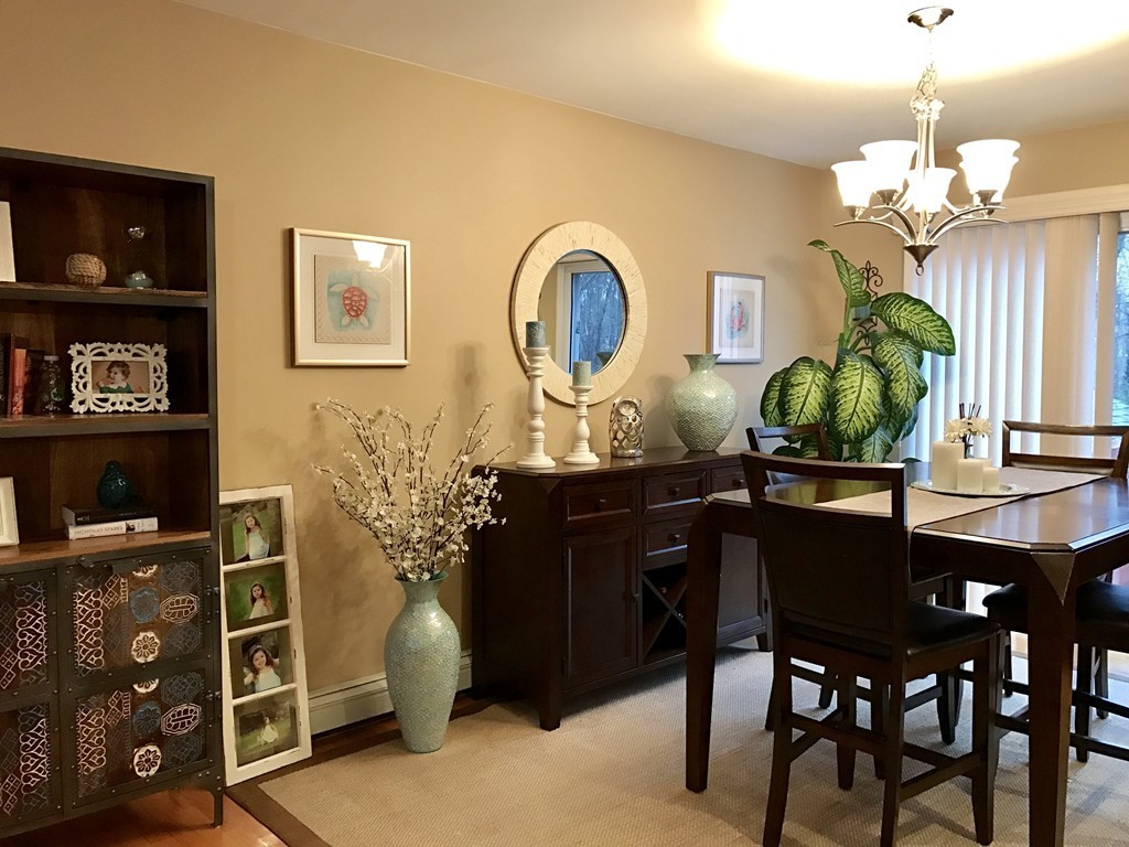 3 Diamond Street Fairhaven, MA 02719 - Photo 4 of 17 a living room with furniture a chandelier and a flat screen tv
