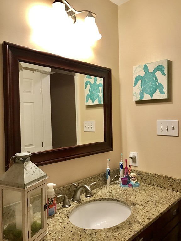 3 Diamond Street Fairhaven, MA 02719 - Photo 8 of 17 a bathroom with a granite countertop sink and a mirror