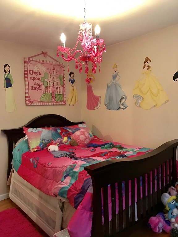 3 Diamond Street Fairhaven, MA 02719 - Photo 10 of 17 a bedroom with a bed that has a blanket and pillows