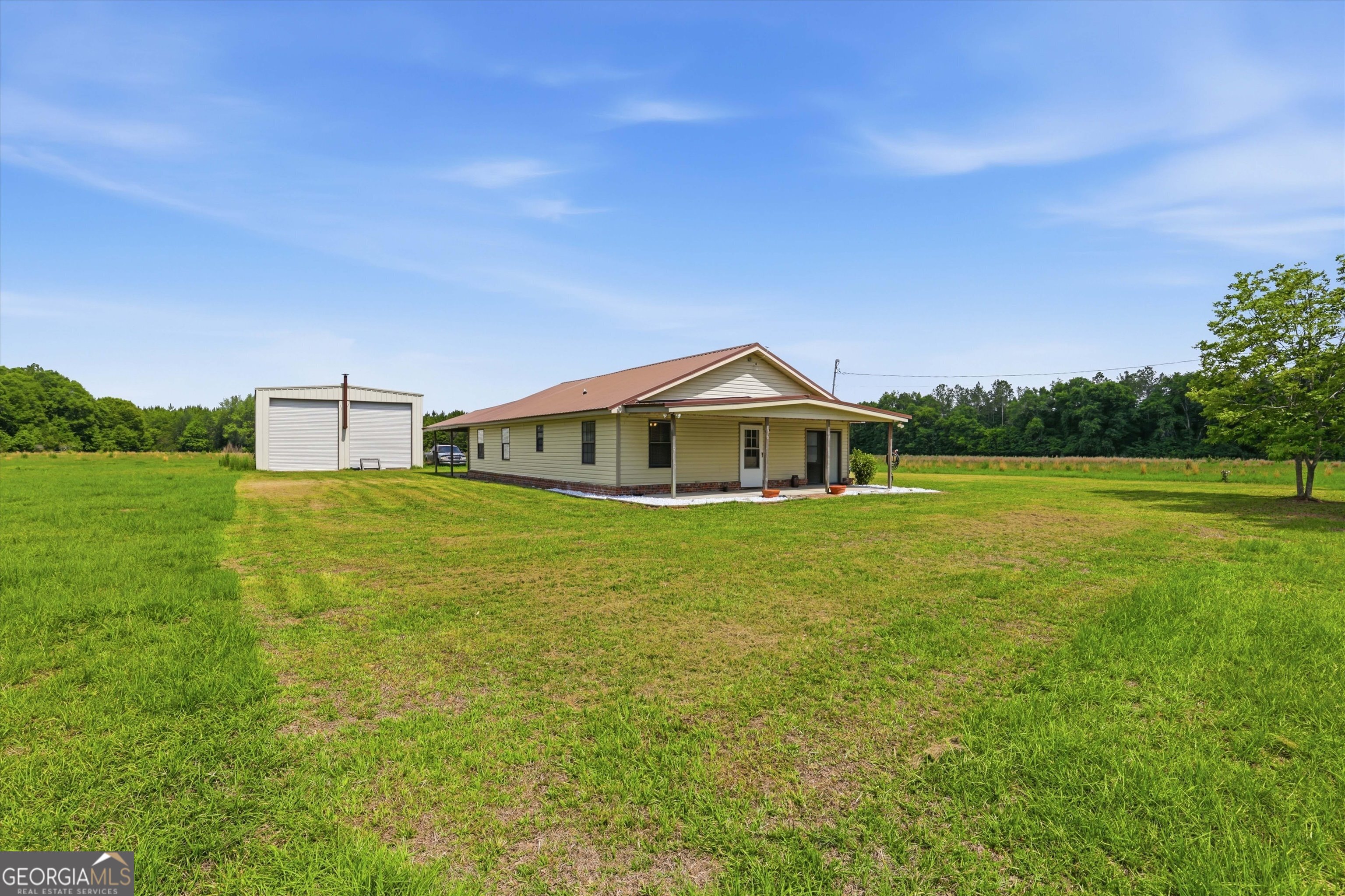 1525 Myron Hart Road Coolidge, GA 31738 - Photo 3 of 58 a front view of a house with garden