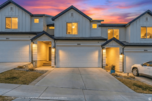 3808 Galatia Road Magna, UT 84044 - Photo 1 of 59 Modern townhome exterior featuring clean lines and contrasting dark trim
