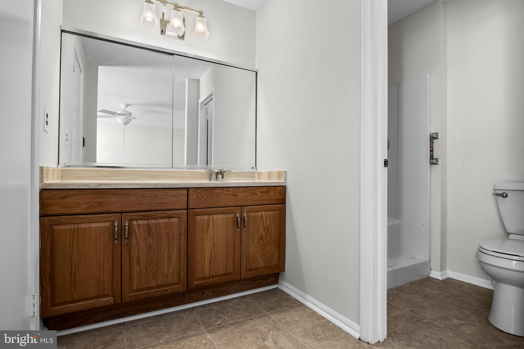 23 Emory Lane Mount Laurel, NJ 08054 - Photo 15 of 23 a bathroom with a sink a toilet and a mirror