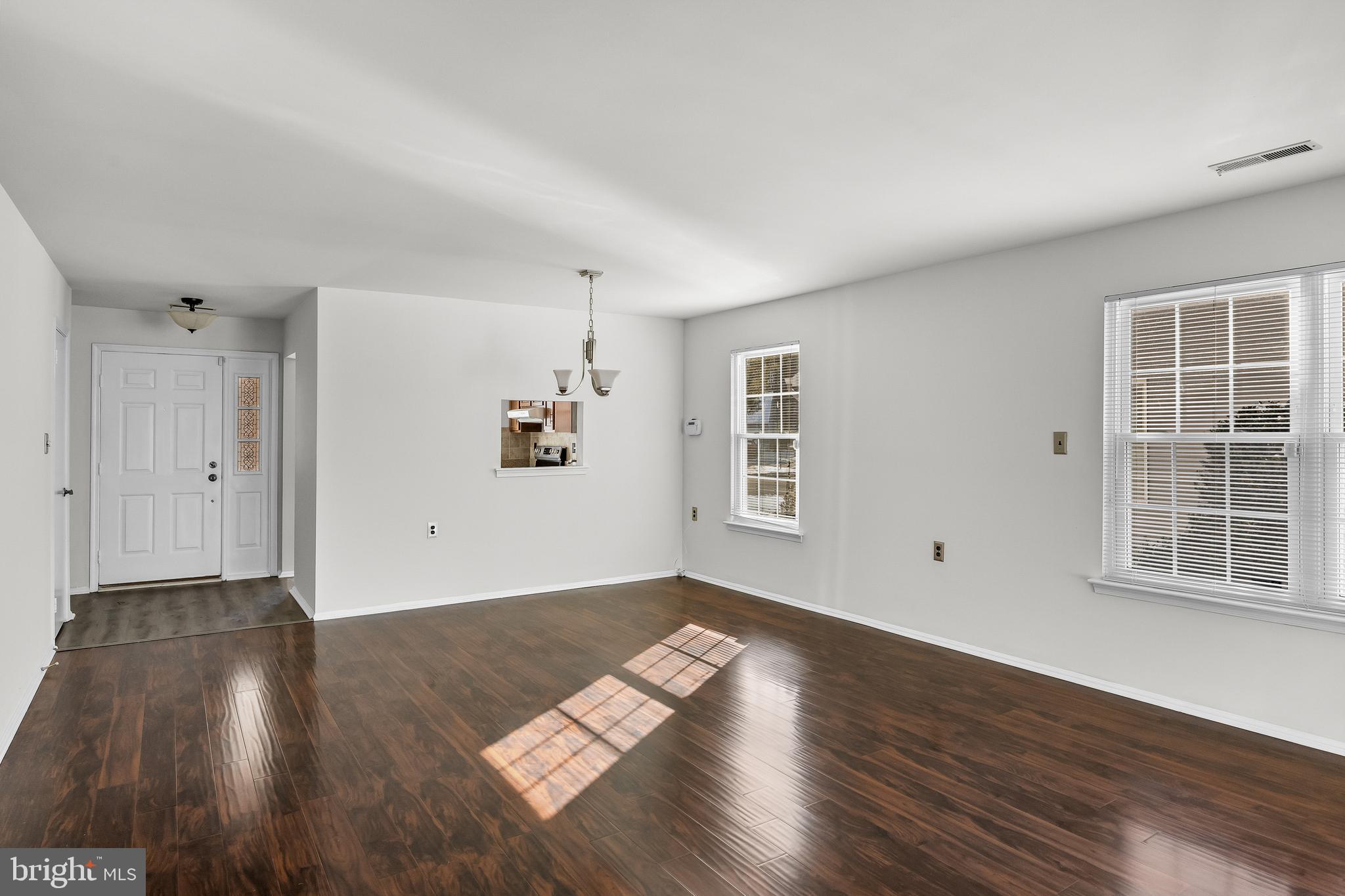 23 Emory Lane Mount Laurel, NJ 08054 - Photo 5 of 23 an empty room with wooden floor and windows