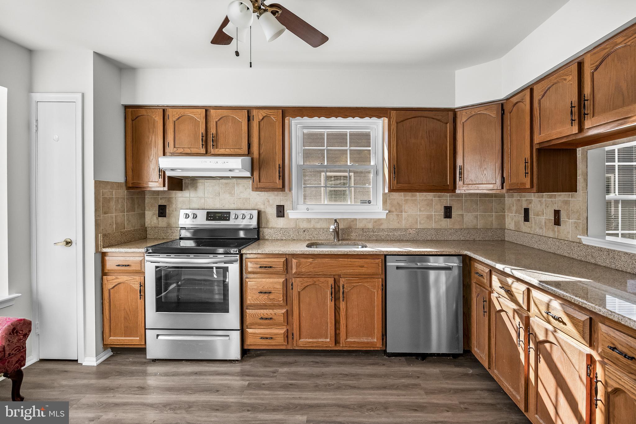 23 Emory Lane Mount Laurel, NJ 08054 - Photo 8 of 23 a kitchen with stainless steel appliances granite countertop a stove a sink and a microwave