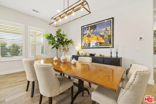 a view of a dining room with furniture and window