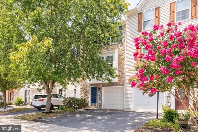 a front view of a house with a garage