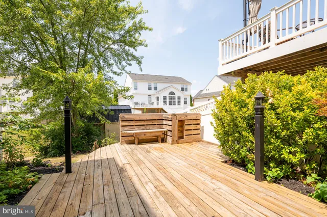a spacious bedroom with a bed and a chandelier