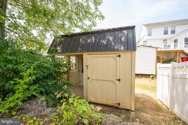 a plant that is sitting in front of a house