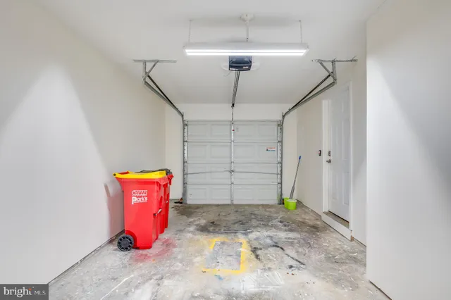 a kitchen with stainless steel appliances granite countertop a stove a sink dishwasher a refrigerator and a dining table with wooden floor