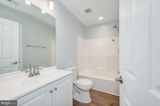 a bathroom with a shower and a bath tub