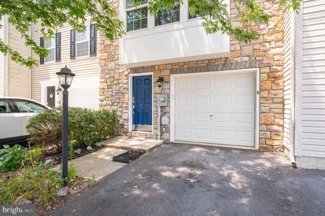 a view of a brick building with a door and a window