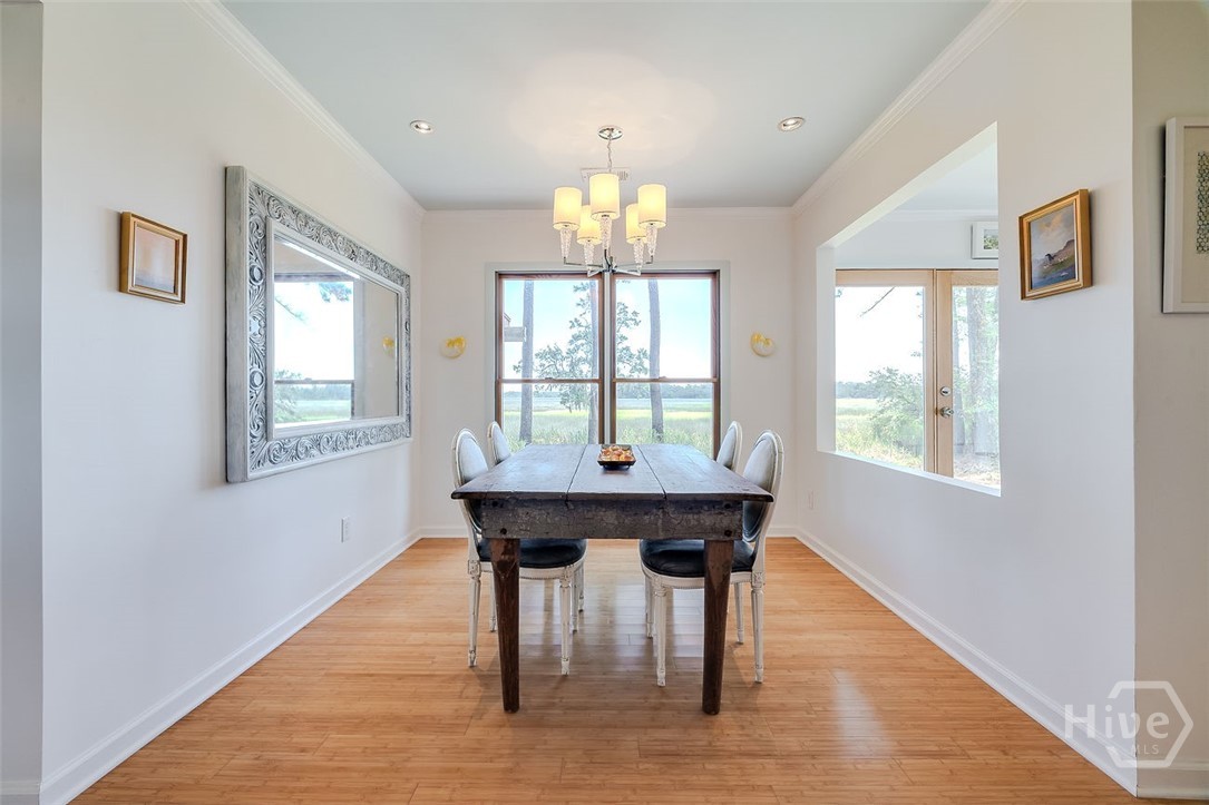 211 Runaway Point Road Savannah, GA 31404 - Photo 13 of 56 The dining room has the same view, and large enoug