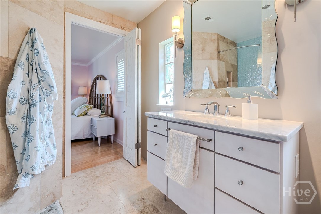 211 Runaway Point Road Savannah, GA 31404 - Photo 27 of 56 The primary bath single vanity with broad marble c