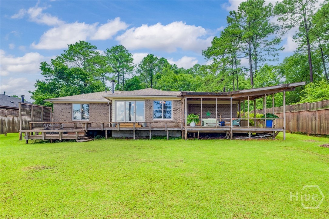 211 Runaway Point Road Savannah, GA 31404 - Photo 45 of 56 The covered deck is built with a mid-century flair